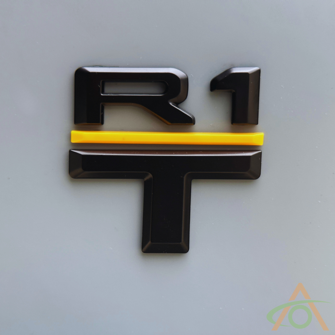 Rear model emblem for R1T in satin black & yellow