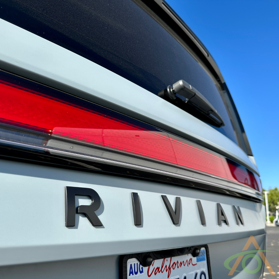 Rear Satin Black Rivian Emblem on an R1S